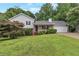 Charming single-Gathering home with a well-maintained lawn and inviting front porch at 1240 Rocky Rd, Lawrenceville, GA 30044