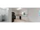 Functional kitchen with white cabinets, black appliances, and ample counter space at 1240 Rocky Rd, Lawrenceville, GA 30044