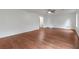 Spacious living room featuring hardwood floors, a ceiling fan, and neutral wall colors at 1240 Rocky Rd, Lawrenceville, GA 30044
