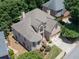 Expansive aerial view showcasing the home's well-maintained roof, brick facade, landscaping, and neighborhood layout at 2002 Ivy Ridge Se Rd, Smyrna, GA 30080