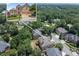Overhead view of a brick two-story home in a tree-lined neighborhood with inset of home's front elevation at 2002 Ivy Ridge Se Rd, Smyrna, GA 30080