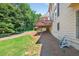 Serene backyard features a spacious deck, well-maintained lawn, and ample room for outdoor activities and gardening at 2002 Ivy Ridge Se Rd, Smyrna, GA 30080