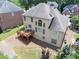 The backyard features a spacious deck, a well-maintained lawn, and a tree-lined perimeter at 2002 Ivy Ridge Se Rd, Smyrna, GA 30080