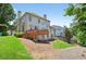 Backyard view with deck and lush green lawn, perfect for outdoor enjoyment at 2002 Ivy Ridge Se Rd, Smyrna, GA 30080