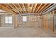 Unfinished basement space with concrete floor, wood framing, and natural light from windows at 2002 Ivy Ridge Se Rd, Smyrna, GA 30080