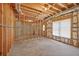 Spacious unfinished basement area with concrete floors and exposed framing at 2002 Ivy Ridge Se Rd, Smyrna, GA 30080