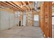 Unfinished basement space with concrete floor, wood framing, and exposed ceiling at 2002 Ivy Ridge Se Rd, Smyrna, GA 30080