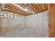 Unfinished basement space with concrete floor, wood framing, and exposed ducts at 2002 Ivy Ridge Se Rd, Smyrna, GA 30080