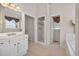 Bright bathroom boasts double doors to shower and bath with tile flooring at 2002 Ivy Ridge Se Rd, Smyrna, GA 30080