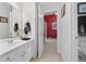 Bright bathroom with white cabinetry, modern fixtures, vanity mirror and neutral decor at 2002 Ivy Ridge Se Rd, Smyrna, GA 30080
