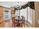 Bright breakfast nook features a round table, chandelier, and sunny windows at 2002 Ivy Ridge Se Rd, Smyrna, GA 30080