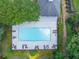 Aerial view of the sparkling community pool, surrounded by lounge chairs and lush greenery for relaxation at 2002 Ivy Ridge Se Rd, Smyrna, GA 30080
