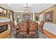 Formal dining room with fireplace, decorative rug, and ample seating at 2002 Ivy Ridge Se Rd, Smyrna, GA 30080