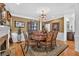 Elegant dining room with chandelier, decorative wallpaper, and large table at 2002 Ivy Ridge Se Rd, Smyrna, GA 30080