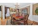 Elegant dining room with chandelier, decorative wallpaper, and large table at 2002 Ivy Ridge Se Rd, Smyrna, GA 30080