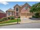 Charming brick two-story home with manicured landscaping, two-car garage, and inviting curb appeal at 2002 Ivy Ridge Se Rd, Smyrna, GA 30080