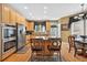 Open kitchen with stainless steel appliances, eat-in island, and hardwood floors at 2002 Ivy Ridge Se Rd, Smyrna, GA 30080