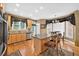 Bright kitchen featuring stainless steel appliances, tile backsplash, and an island with seating at 2002 Ivy Ridge Se Rd, Smyrna, GA 30080
