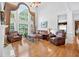 Inviting living room with soaring ceilings, hardwood floors, and a fireplace for a comfortable and stylish space at 2002 Ivy Ridge Se Rd, Smyrna, GA 30080