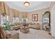 Cozy formal living room with neutral decor, stylish window treatments, and comfortable seating arrangements at 2002 Ivy Ridge Se Rd, Smyrna, GA 30080