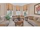 Inviting living room featuring elegant decor, plush seating, and ample natural light through large windows at 2002 Ivy Ridge Se Rd, Smyrna, GA 30080