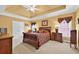 Spacious main bedroom with tray ceilings, and a king-size bed at 2002 Ivy Ridge Se Rd, Smyrna, GA 30080