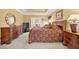 Cozy main bedroom featuring a decorative mirror and well-crafted wooden furniture at 2002 Ivy Ridge Se Rd, Smyrna, GA 30080