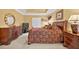 Elegant main bedroom boasts tray ceilings, plush carpet, and stylish furnishings at 2002 Ivy Ridge Se Rd, Smyrna, GA 30080