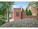 Welcoming Oak Ridge Estates brick entrance sign surrounded by manicured landscaping adds charm and curb appeal at 2002 Ivy Ridge Se Rd, Smyrna, GA 30080