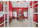 Home office with red walls, white ceiling, and a stately desk with computer at 2002 Ivy Ridge Se Rd, Smyrna, GA 30080