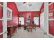 Home office with red walls, white ceiling, and a stately desk with computer at 2002 Ivy Ridge Se Rd, Smyrna, GA 30080