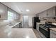 Updated kitchen featuring granite countertops and stainless steel appliances at 7156 Whitfield Drive Dr, Riverdale, GA 30296