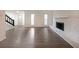 Open floor plan of the living room with stairs and decorative fireplace at 7156 Whitfield Drive Dr, Riverdale, GA 30296