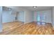 Finished basement featuring hardwood floors, a staircase, and french doors leading to the outside at 4185 Duesenberg Dr, Tucker, GA 30084