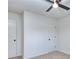 Bedroom features a ceiling fan and two doors with black hardware at 4185 Duesenberg Dr, Tucker, GA 30084