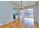Hardwood floors throughout bright open concept living room, kitchen, and dining areas at 4185 Duesenberg Dr, Tucker, GA 30084