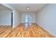 Bright living room with gleaming hardwood floors and french doors to the outside at 4185 Duesenberg Dr, Tucker, GA 30084