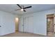 Bedroom with ceiling fan, large closet and adjacent bathroom at 4185 Duesenberg Dr, Tucker, GA 30084