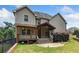 Large backyard with patio and covered deck with outdoor seating and a grassy area at 4465 Saint Andrews Crest Dr, Cumming, GA 30040