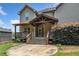 Wide backyard view with covered porch, patio, and well-maintained lawn at 4465 Saint Andrews Crest Dr, Cumming, GA 30040