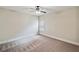 Neutral-toned bedroom with a ceiling fan, window with blinds, and plush carpet at 4465 Saint Andrews Crest Dr, Cumming, GA 30040