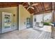 Covered deck with a swing, wood floors, and ceiling fan at 4465 Saint Andrews Crest Dr, Cumming, GA 30040