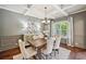Elegant dining room featuring coffered ceilings, a modern chandelier, and wainscoting at 4465 Saint Andrews Crest Dr, Cumming, GA 30040