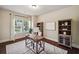 Cozy home office with hardwood floors, large window, and built-in bookshelves at 4465 Saint Andrews Crest Dr, Cumming, GA 30040