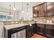 Well-equipped kitchen features granite countertops, stainless steel appliances, and ample cabinet space for storage and meal prep at 4465 Saint Andrews Crest Dr, Cumming, GA 30040