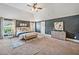 Spacious main bedroom with a vaulted ceiling, blue accent wall, and ample natural light at 4465 Saint Andrews Crest Dr, Cumming, GA 30040