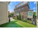 Private outdoor balcony offers a serene view with artificial turf and stylish black railing at 504 E Howard Ave, Decatur, GA 30030