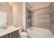 Modern bathroom showcasing a tub-shower combination with stylish tile surround and vanity at 504 E Howard Ave, Decatur, GA 30030