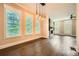 Elegant dining room area with hardwood floors, plantation shutters, and modern lighting at 504 E Howard Ave, Decatur, GA 30030