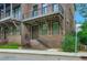 Beautiful brick townhouse featuring a charming covered entrance and elegant iron railings at 504 E Howard Ave, Decatur, GA 30030